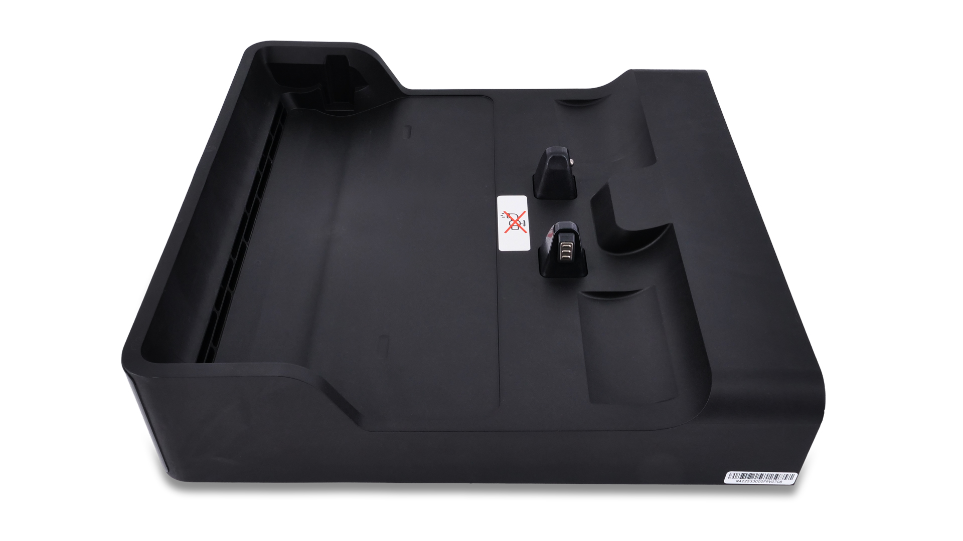 Eine schmale Bürste mit einem Stiel aus Draht liegt auf einer weißen Fläche.